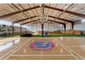 Indoor court with basketball court and Jayhawks logo at 6302 Charrington Dr, Cherry Hills Village, CO 80111