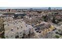 An aerial view shows the apartment building and surrounding streets, showcasing parking and nearby buildings at 375 Josephine St # D, Denver, CO 80206