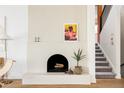 Bright living room with a modern fireplace, neutral tones, and elegant decor at 3445 S Clermont St, Denver, CO 80222