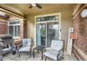 Inviting patio with grill, seating, and brick accents, perfect for outdoor entertaining at 6476 Silver Mesa Dr # A, Highlands Ranch, CO 80130