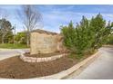 Stone sign reading 'Silver Mesa', surrounded by landscaping, at the community entrance at 6476 Silver Mesa Dr # A, Highlands Ranch, CO 80130