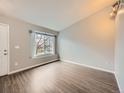 Bright living room with natural light, hardwood floors, and neutral paint, creating a welcoming space at 378 Benton St, Castle Rock, CO 80104