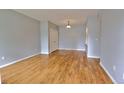 Open-concept living room featuring wood floors, ample natural light, and neutral paint creating a serene environment at 2809 Syracuse Ct # 129, Denver, CO 80238