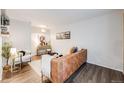 Bright living room showcasing modern decor, sleek wood floors, and comfortable seating arrangement at 1349 Race St # 5, Denver, CO 80206