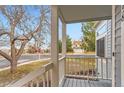 Inviting porch showcasing the neighborhood view and a glimpse of a well-maintained street at 2358 Dogwood Cir, Louisville, CO 80027