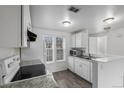 Bright kitchen with white cabinets, granite countertops, and stainless steel appliances at 1514 S Ouray Cir # B, Aurora, CO 80017