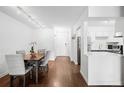 Cozy dining area with wood floors, and a table for four at 1313 N Williams St # 301, Denver, CO 80218