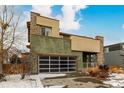 Contemporary two-story home with stone and siding exterior at 10081 Truckee St, Commerce City, CO 80022