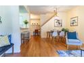 Bright dining area with hardwood floors and a charming light fixture at 6424 Silver Mesa Dr # C, Highlands Ranch, CO 80130