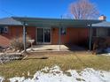 Covered patio with concrete flooring and small bird bath at 5922 S Otis Ct, Littleton, CO 80123