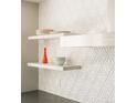 White geometric backsplash with floating shelves in kitchen at 1133 14Th St # 2720, Denver, CO 80202