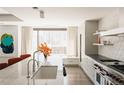 Modern kitchen features marble countertops and city views at 1133 14Th St # 2720, Denver, CO 80202