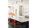 Modern kitchen with marble countertops and geometric backsplash at 1133 14Th St # 2720, Denver, CO 80202