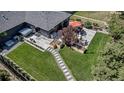 Overhead view of backyard featuring a patio area complete with a hot tub, dining set, and grill at 4930 Gray St, Denver, CO 80212