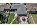 Aerial view showcasing a well-maintained backyard with a patio, outdoor seating, and a hot tub at 4930 Gray St, Denver, CO 80212