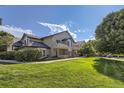 Beautiful condominium with manicured lawn and mature trees at 8757 E Dry Creek Rd # 1512, Englewood, CO 80112