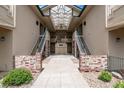 Exterior courtyard view showing entrances and well maintained brick, shrubs and architectural details at 8757 E Dry Creek Rd # 1512, Englewood, CO 80112