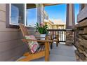Inviting covered porch with comfortable seating and stone accents, offering a cozy outdoor space at 18130 Bolero Dr, Parker, CO 80134