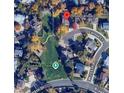Aerial view shows the house's location near Meadowlark Park in a neighborhood with mature trees at 10566 Canosa Ct, Denver, CO 80234