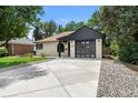 Well-maintained ranch-style home with updated garage door and modern trim at 1045 Locust St, Denver, CO 80220