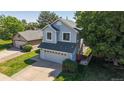 Charming two-story home with inviting front porch and well-maintained lawn at 3755 Shefield Dr, Broomfield, CO 80020