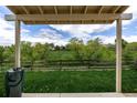Beautiful backyard view features lush greenery, mature trees, and a lovely fence creating a private outdoor space at 5238 S Jericho Way, Centennial, CO 80015