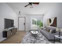 Cozy living room with neutral decor, a stylish rug, and comfortable seating creates an inviting atmosphere at 5238 S Jericho Way, Centennial, CO 80015