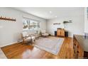 Cozy living room with hardwood floors, large window, and ample natural light at 9325 Meade St, Westminster, CO 80031