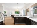 Bright, open-concept kitchen with sleek cabinetry, marble countertops, and stainless steel appliances at 3727 Tejon St, Denver, CO 80211