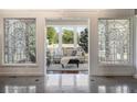 Sunroom with stained glass windows and comfortable seating at 17575 E Kettle Pl, Centennial, CO 80016