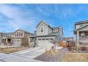 Attractive two-story home featuring a two-car garage, complemented by professional landscaping at 1066 S Eaton Park Ct, Aurora, CO 80018