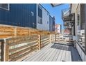 Private backyard deck offers ample space for relaxation and outdoor gatherings at 5530 W 11Th Pl, Lakewood, CO 80214