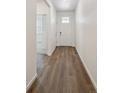 Welcoming entryway featuring durable wood-look flooring and a bright white door at 6501 14Th St, Frederick, CO 80530