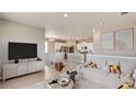 Inviting living room open to the kitchen and dining area, perfect for entertaining at 6501 14Th St, Frederick, CO 80530