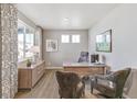 Home office featuring wood desk, two chairs, and a large window at 3274 Belleville Ridge Rd, Elizabeth, CO 80107