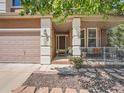 Inviting front porch with charming details and lovely landscaping, perfect for relaxing at 13891 Muirfield Ct, Broomfield, CO 80023