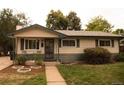 Lovely ranch home featuring great curb appeal and a spacious front yard at 6213 Gray St, Arvada, CO 80003
