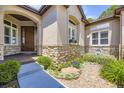 Inviting entrance with stone accents and decorative landscaping creates a warm and welcoming curb appeal at 11070 Meade Ct, Westminster, CO 80031