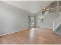 Bright, open-concept living room with hardwood floors and large windows, offering lots of natural light at 11578 Clayton St, Thornton, CO 80233