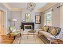 Bright living room with hardwood floors, a fireplace, and stylish decor at 347 Bannock St, Denver, CO 80223