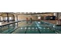 Indoor swimming pool featuring clear blue water, marked lanes, and lifeguard equipment visible at 725 Cottonwood Ave, Bennett, CO 80102