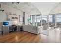 Modern living room with hardwood floors and city views at 1700 Bassett St # 1008, Denver, CO 80202