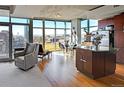 Bright, open-concept living space with floor-to-ceiling windows and views of the city at 1700 Bassett St # 1008, Denver, CO 80202