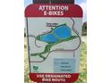 Attention E-Bikes sign with the Twin Lakes Trailhead map details bike routes, parking, and other features at 6505 Kalua Rd # 204B, Boulder, CO 80301