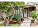 Inviting home entrance featuring a cozy bench and a decorative door wreath at 9620 W Chatfield Ave # D, Littleton, CO 80128