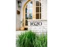 Elegant house number '1620' displayed near the front door, complemented by lush greenery at 1620 S Ogden St, Denver, CO 80210