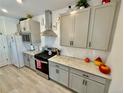 This kitchen features modern appliances, sleek countertops, and ample cabinet space at 27580 E Cedar Pl, Aurora, CO 80018