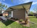 A stylish brick home boasting modern design elements, a covered carport, and carefully landscaped grounds for enhanced curb appeal at 3355 Moorhead Ave, Boulder, CO 80305