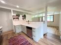 Bright kitchen with a stainless steel dishwasher, white countertops, and light gray cabinets at 3355 Moorhead Ave, Boulder, CO 80305