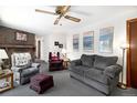 Comfortable living room offers plush seating, a brick fireplace, and a warm ambiance for relaxation and gatherings at 4740 Lee Cir, Boulder, CO 80303